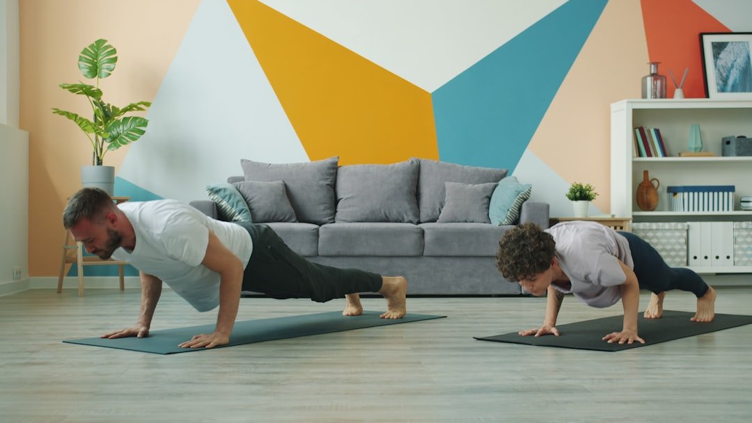 Man and woman doing push-ups on yoga mats