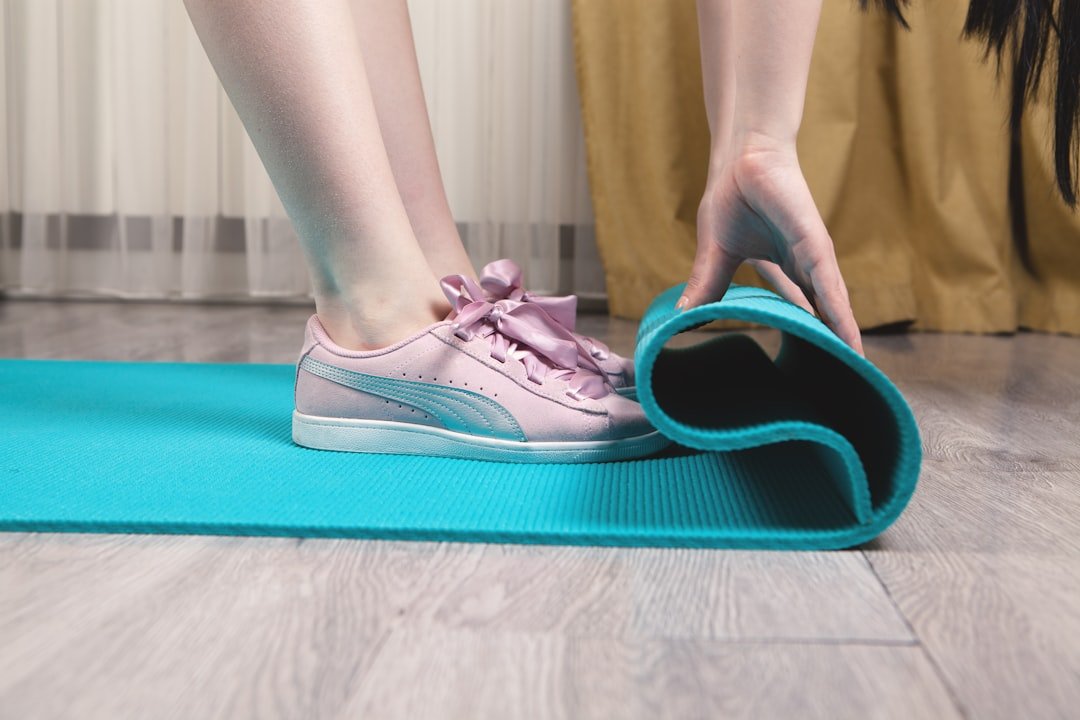 person wearing teal and white nike sneakers